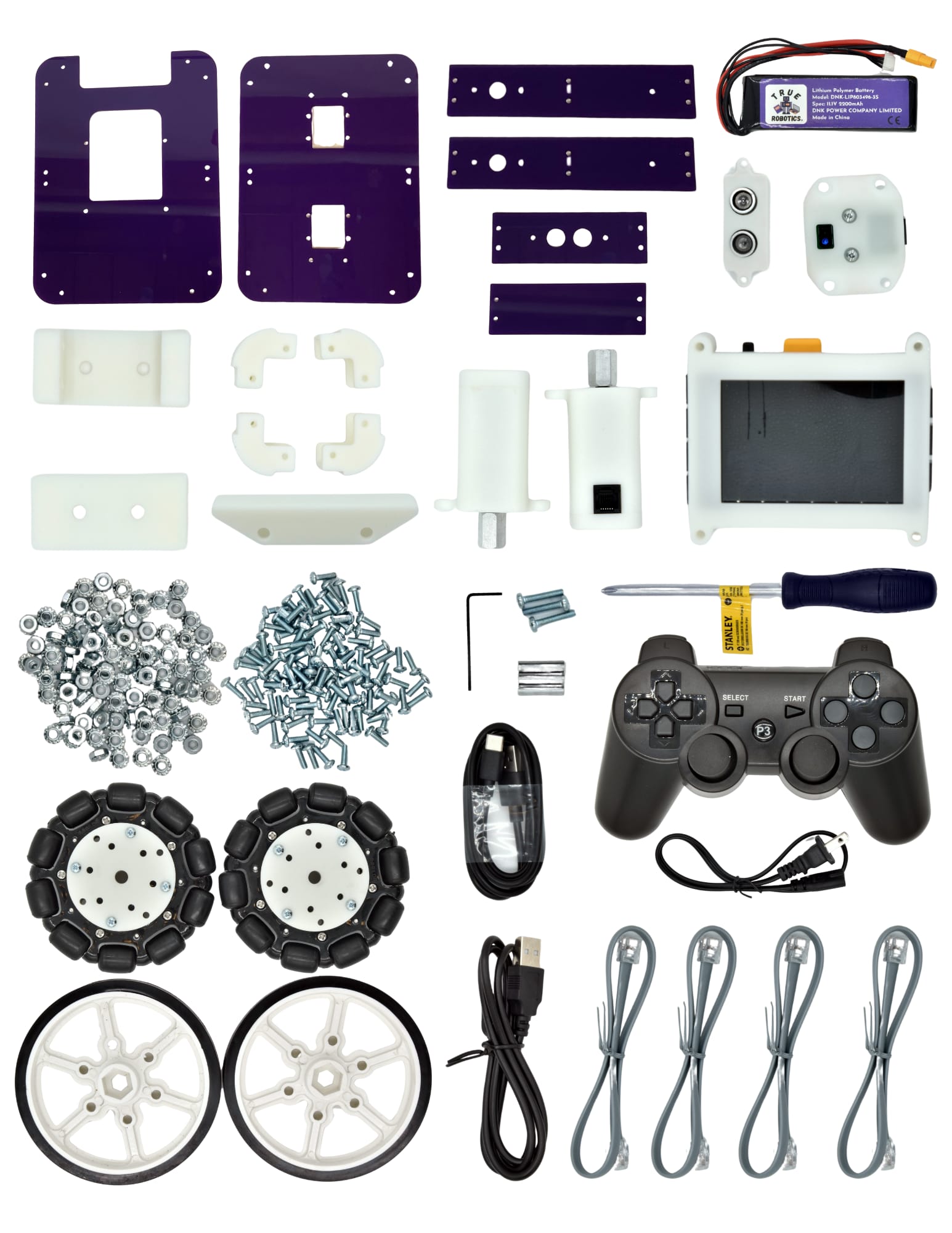 The parts of an Axle Robot Kit laid out on white: purple plates, white brackets, motors, omni wheels, a screen, a battery, a game controller, a screwdriver, screws and cables